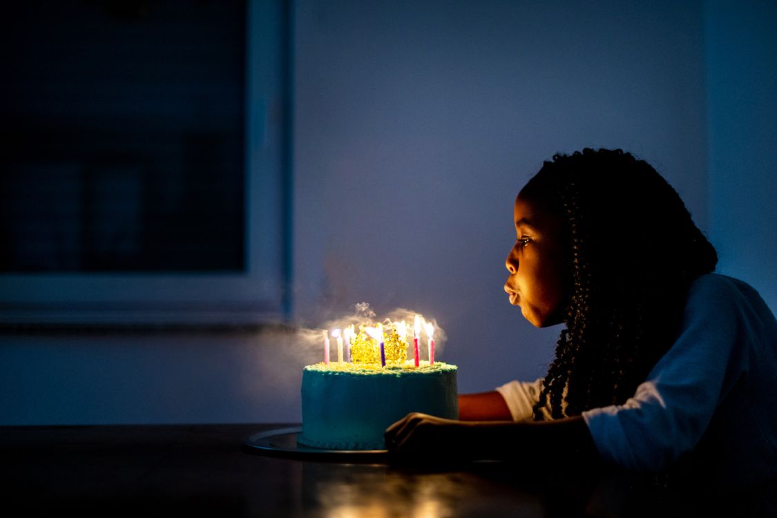 Girl Blowing out Birthday Candles