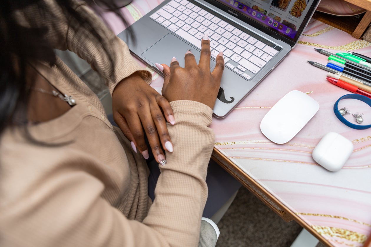 Modern Office Setup: Laptop and Writing Pens
