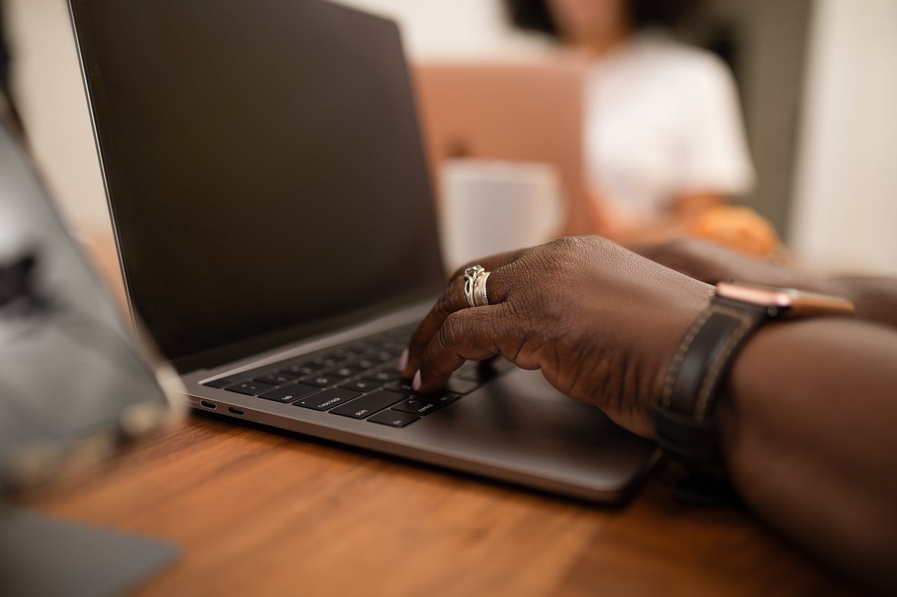 A woman works on a laptop