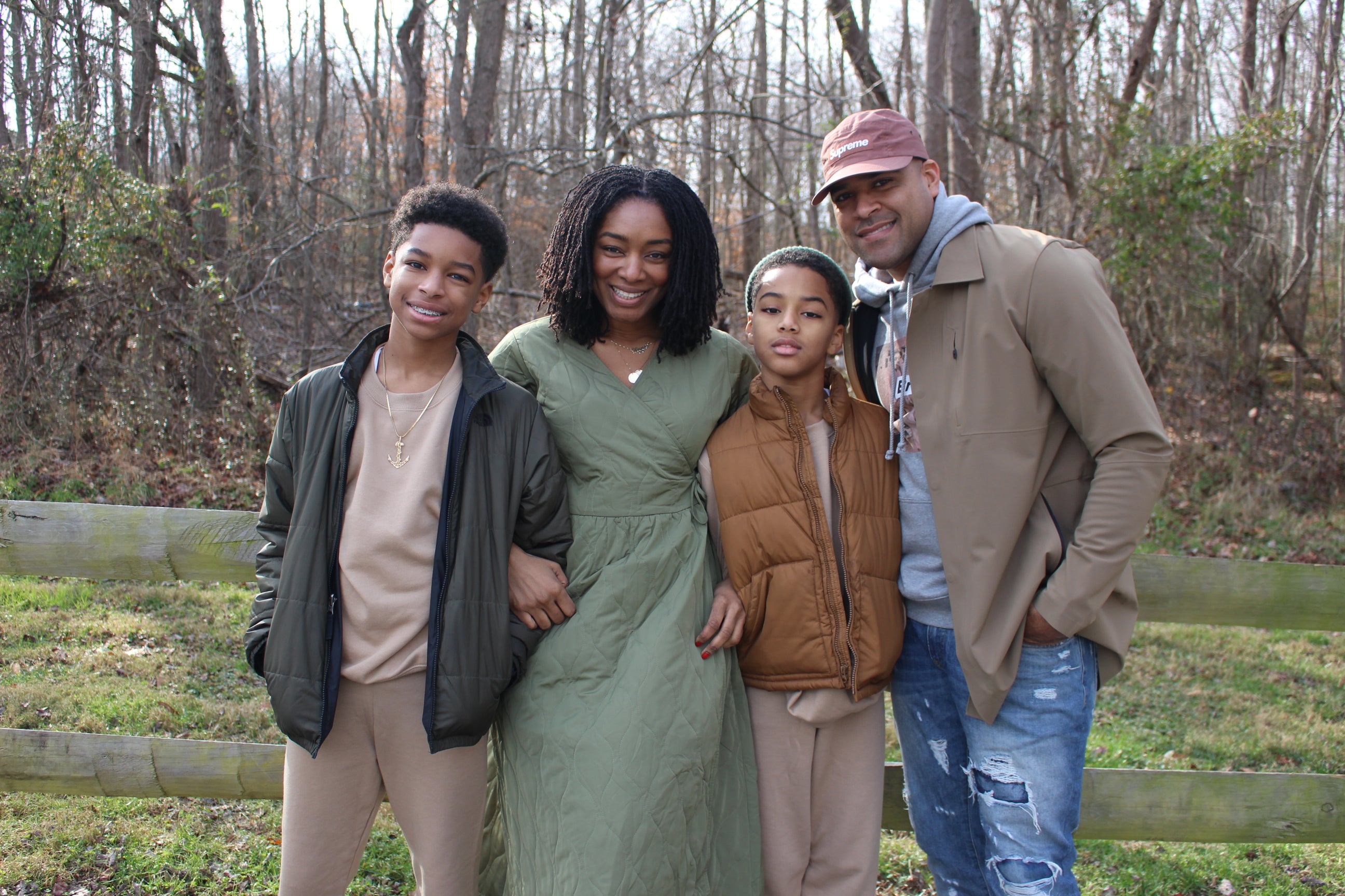 Family outdoors smiling together