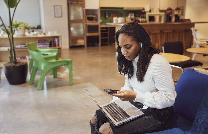 A new hire taking an onboarding lesson on a laptop