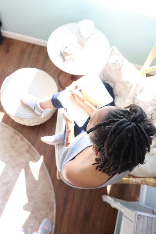 black woman with journal