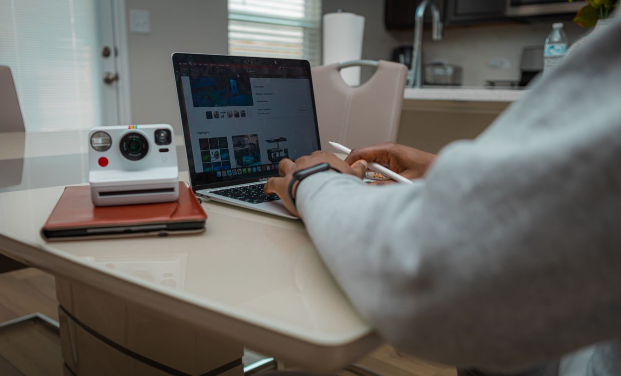 Home Workstation with Laptop and Instant Camera