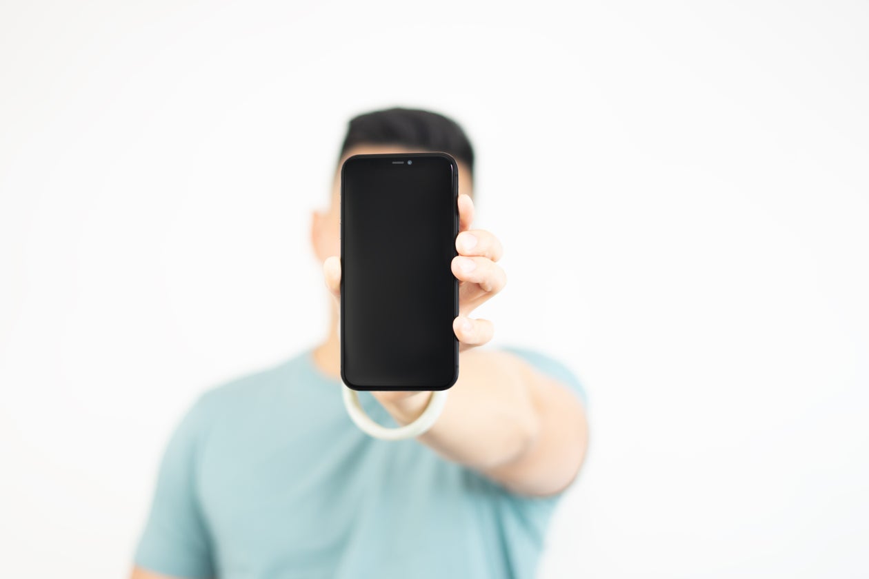 Person holding up a phone