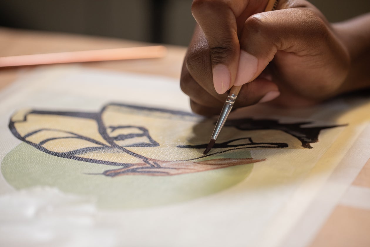 Artist painting on canvas