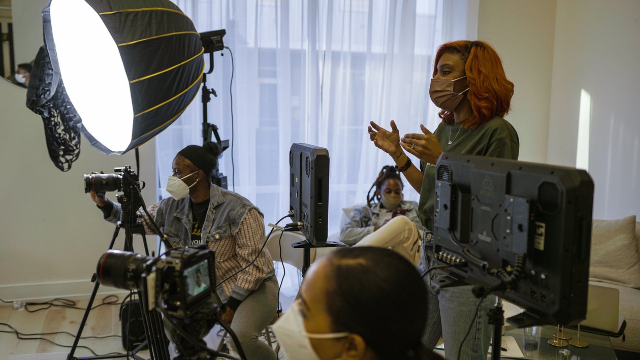 Production Team Behind the Photography Equipment