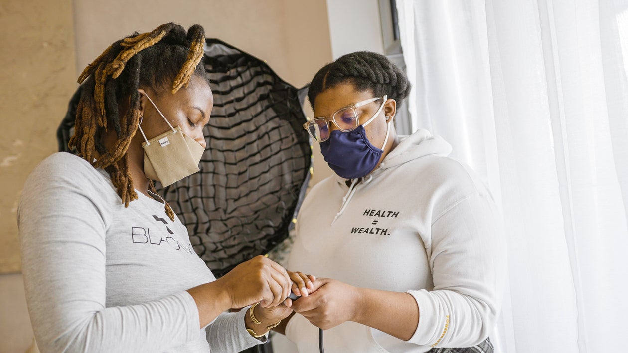 Two Black Woman with white clothes