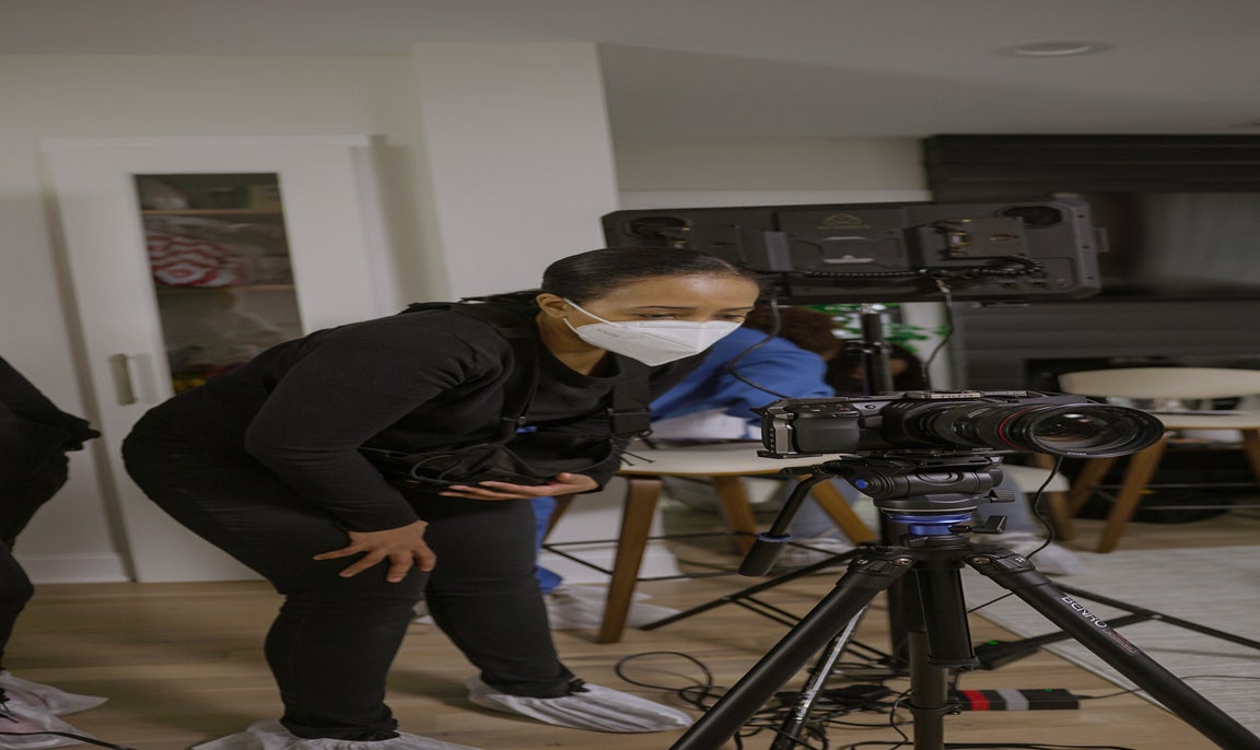 Camerawoman behind a camera