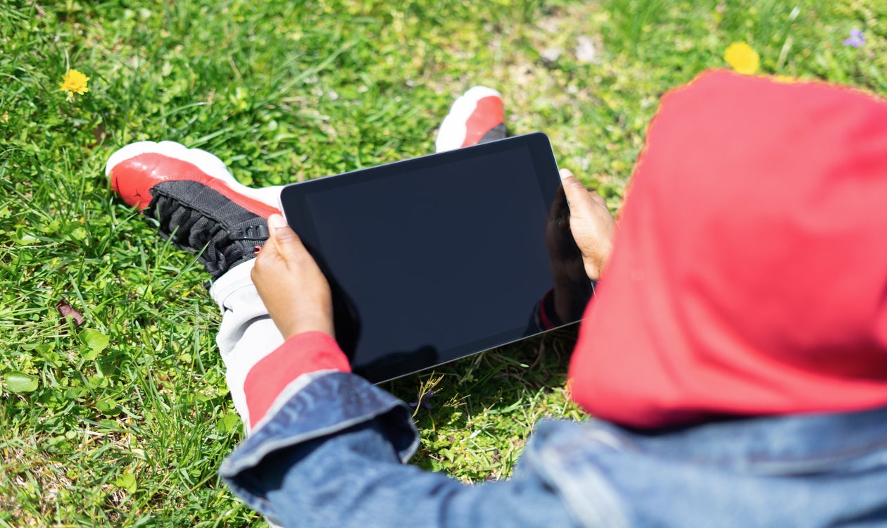 Child holding a tablet