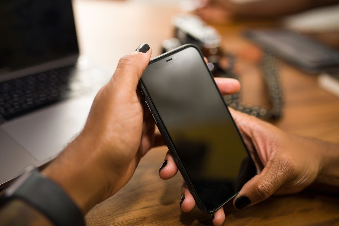 Hands holding phone