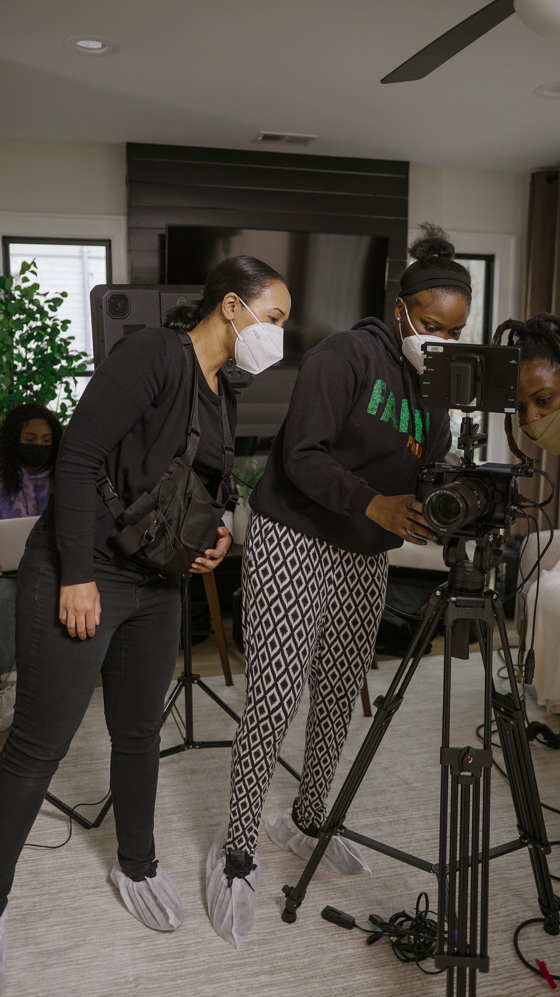 Camerawoman setting up the camera