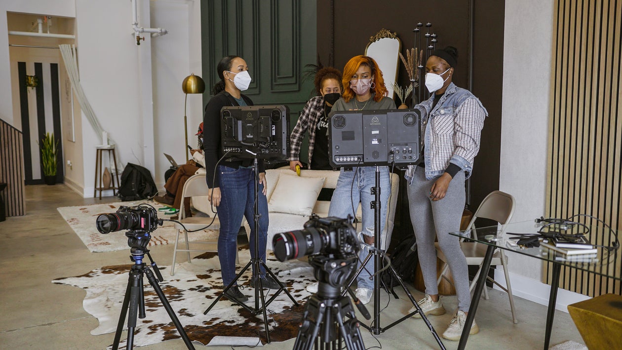 Production Team on Set Behind Equipment