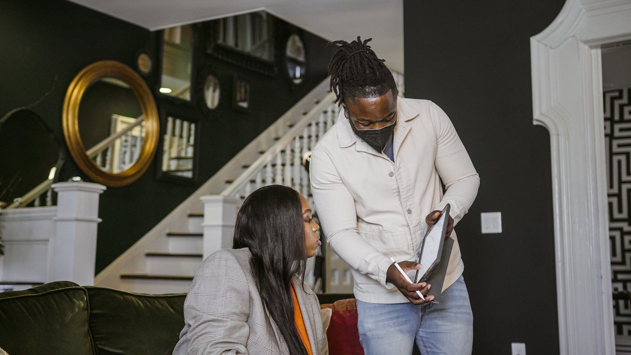 Man showing an iPad to a woman