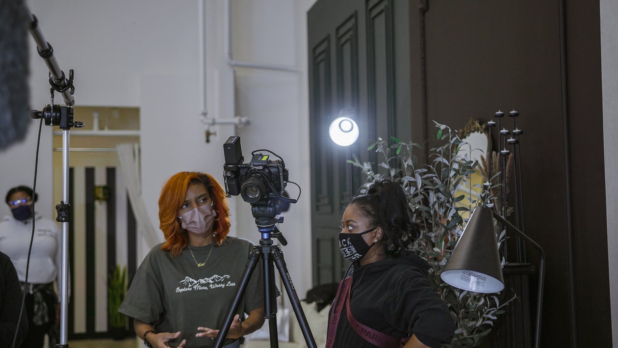 Black Woman Behind a Camera