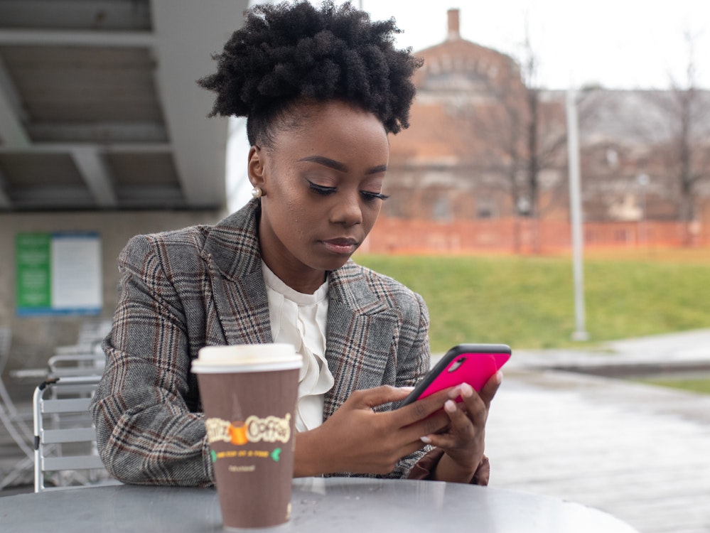 Girl texting on phone @NappyStock | Black & Brown stock photos