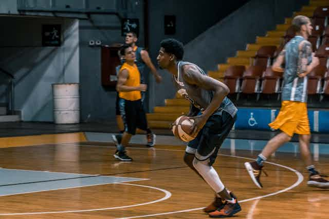 Man playing basketball