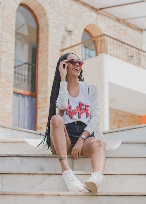 Woman sitting on stairs