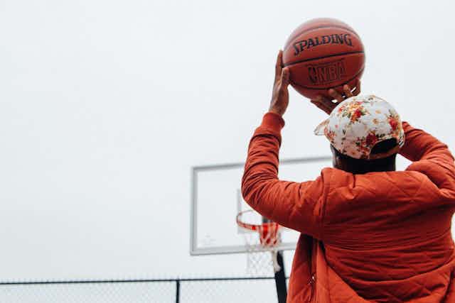 Man shooting basketball