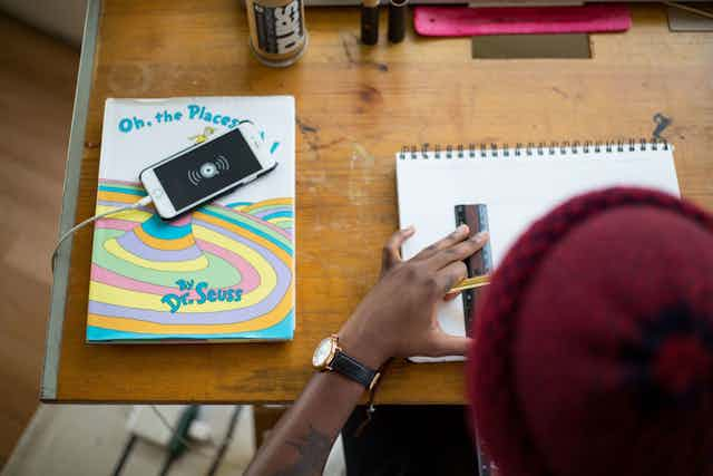 Man drawing on a table