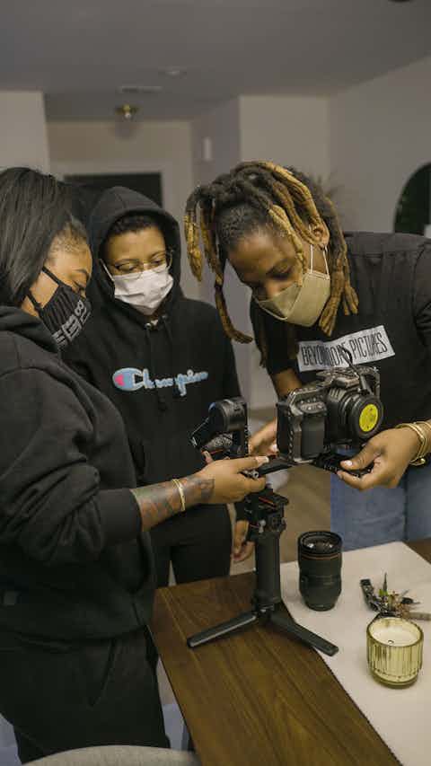 Production team setting up a camera