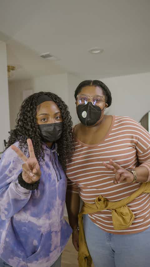 2 Black Woman with a peace sign