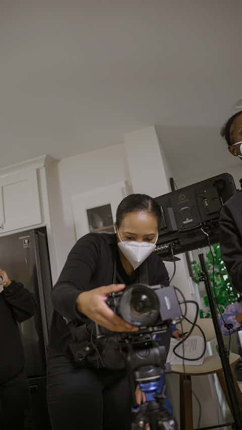 Camerawoman holding a camera