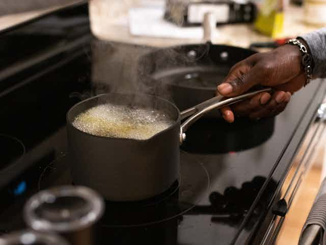 Man cooking with pot