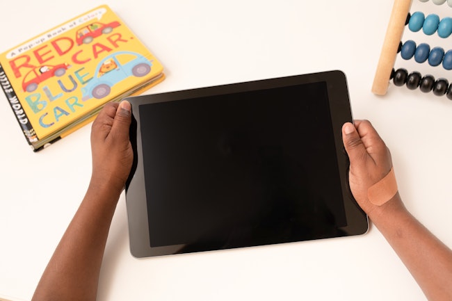 Child holding a tablet