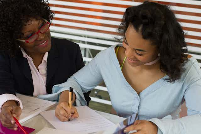 woman tutoring her student