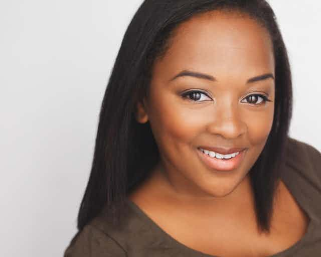 Black woman smiling for camera