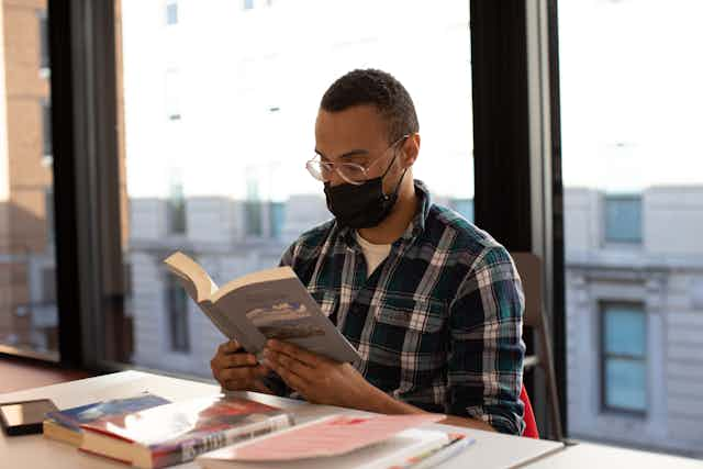 Man reading books