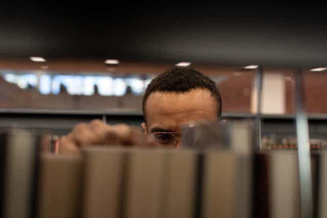 man in library