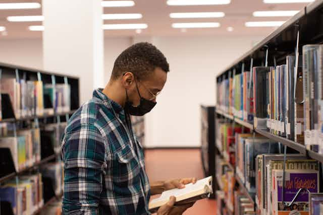 man in library