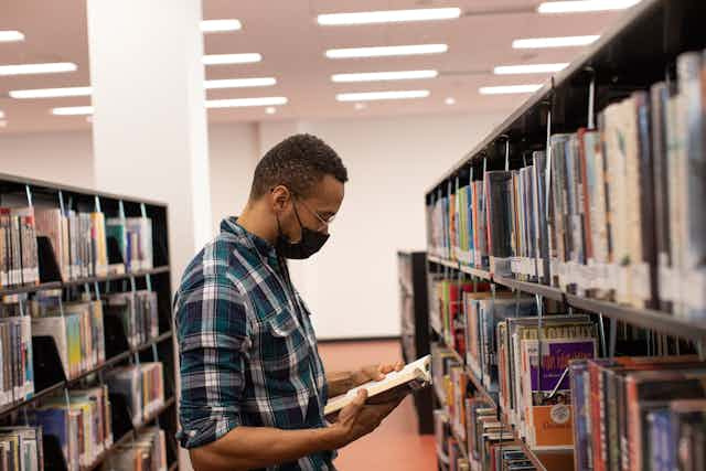 man in library