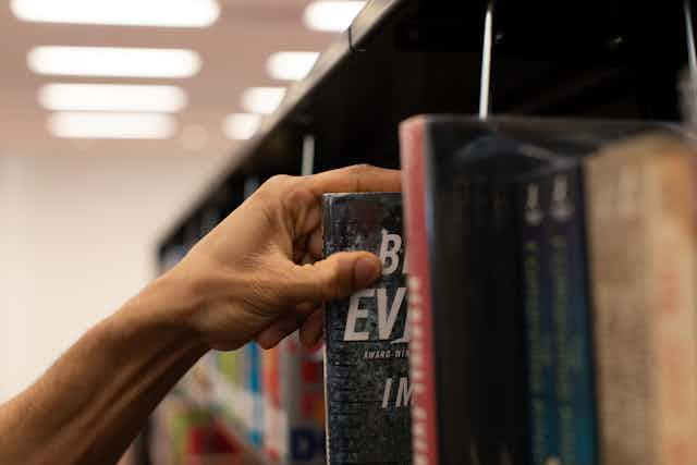 man in library