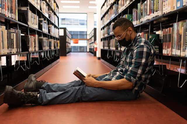 man in library