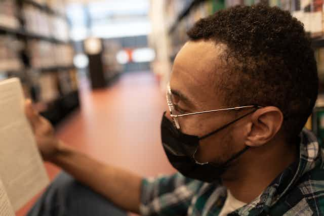 man in library