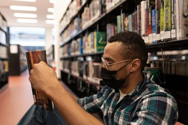 man in library