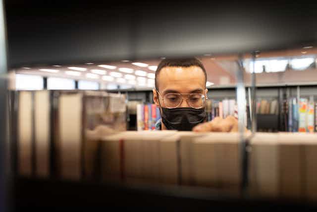 man in library