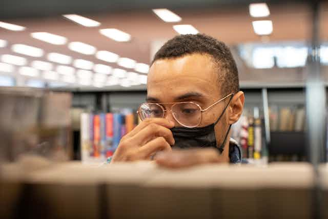 man in library