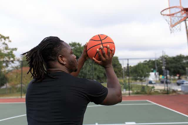 Man Playing Basketball