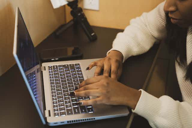 Woman Engaged in Laptop Work