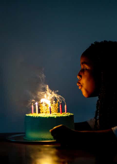 Girl Blowing out Birthday Candles