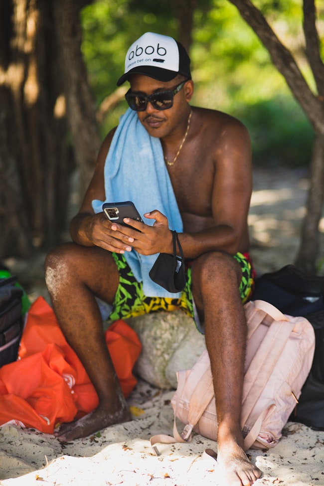 Man with Smartphone at the Beach