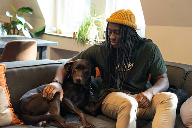 Man playing with dog