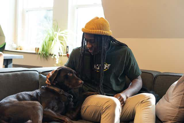 Man playing with dog