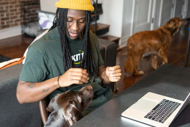 Man playing with dog