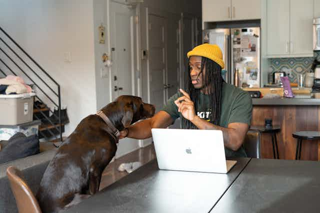 Man playing with dog