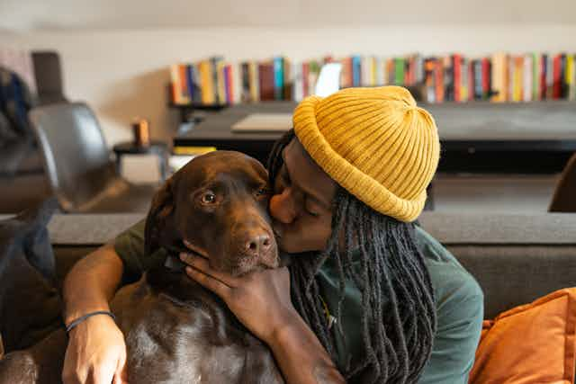 Man playing with dog