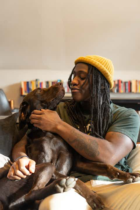 Man playing with dog